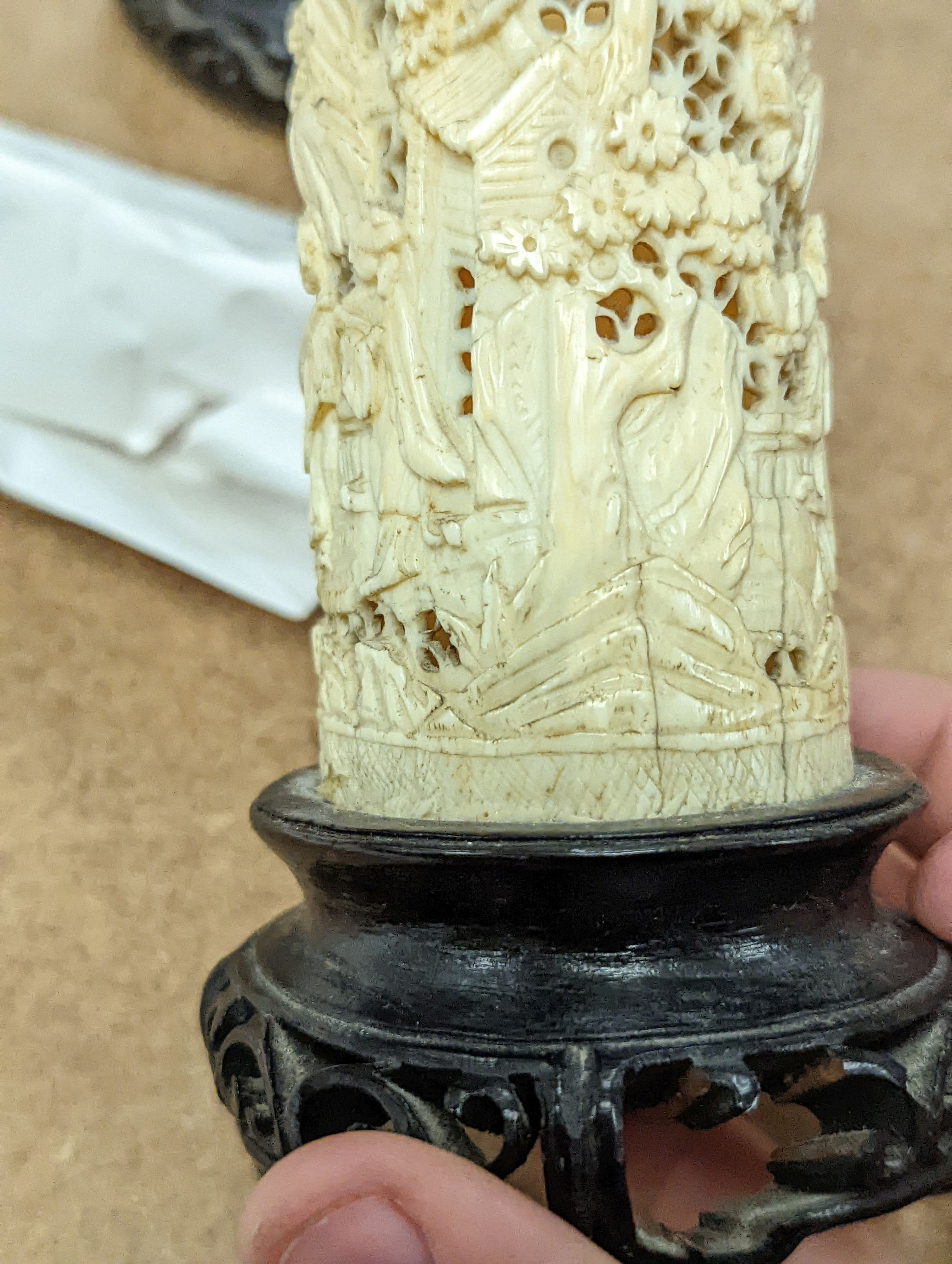 A pair of 19th century Chinese carved ivory brushpots on wooden stands - 12cm tall (including stands)